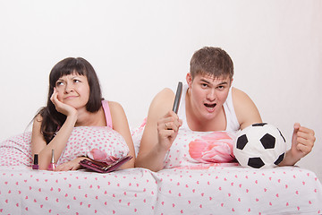 Image showing Husband picked the TV remote and watch soccer