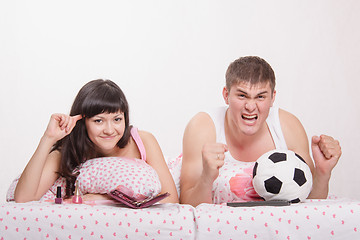 Image showing Husband, according to his wife crazy with football