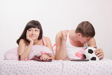 Image showing Husband not upset by goal scored, wife was tired football