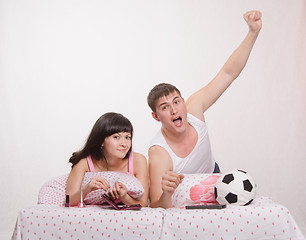 Image showing Celebrates after scoring husband, wife watch soccer