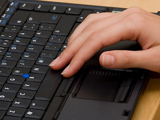 Image showing Woman typing on a laptop