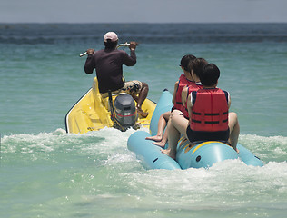 Image showing Banana boat and water scooter