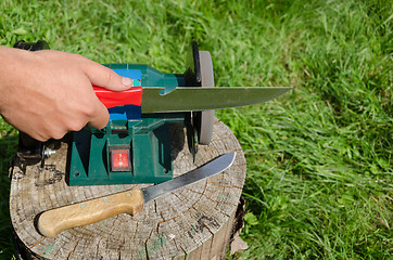 Image showing Hand grinder knife with electric tool 