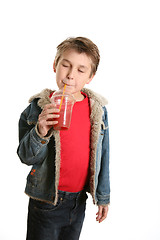 Image showing Sipping a fresh fruit juice