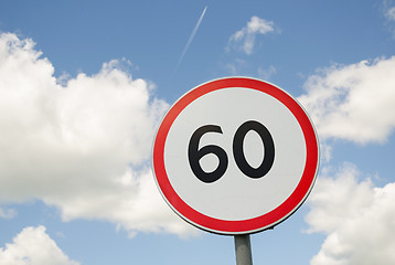 Image showing road traffic round sign limiting speed on blue sky 