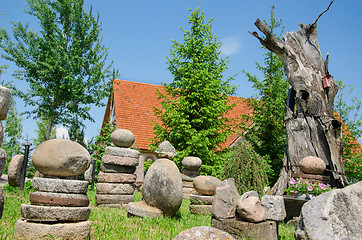 Image showing stone composition in village in summer park 