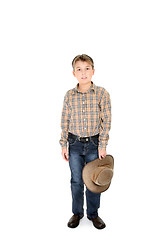 Image showing Country boy holding hat