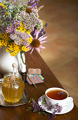 Image showing Still life from medicinal herbs, honey, herbal tea and medicines