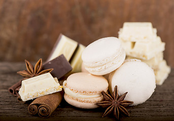 Image showing Chocolate macaroons with pieces of white and black chocolate