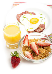 Image showing Breakfast with bacon, fried egg and orange juice