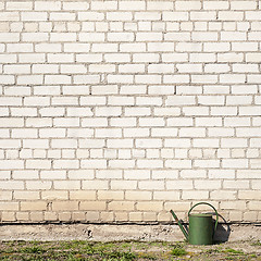 Image showing watering can near the wall