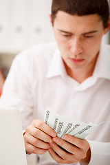 Image showing businessman with cash