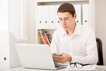 Image showing man with laptop and money