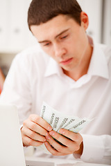 Image showing man counting money