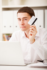 Image showing man holding credit card