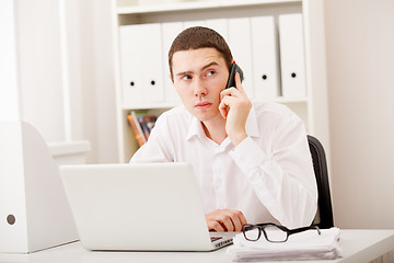 Image showing businessman on phone sitting