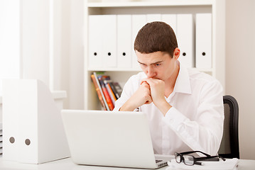 Image showing man thinking in office