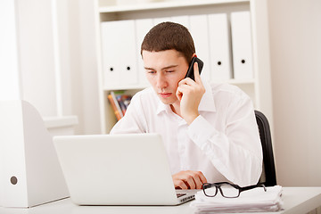 Image showing businessman on phone sitting