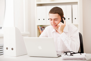 Image showing businessman on phone sitting