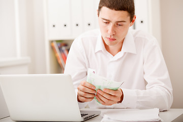 Image showing man with laptop and money