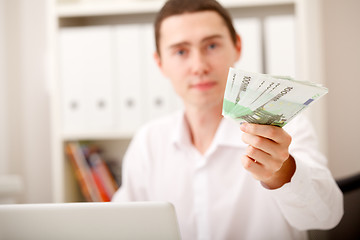 Image showing man with Euro in office