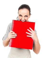 Image showing business woman bites in a red binder