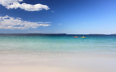 Image showing Kayakers enjoy the crystal clear waters Australian Beach