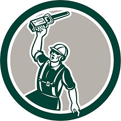 Image showing Arborist Holding Up Chainsaw Circle Retro