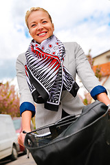 Image showing Woman riding bicycle.