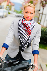 Image showing Woman riding bicycle.