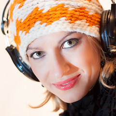 Image showing Blonde lady listening to the music.