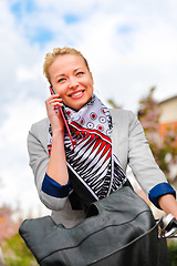 Image showing Woman riding bicycle.