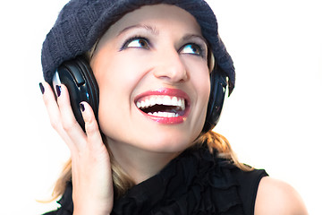 Image showing Blonde lady listening to the music.