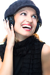 Image showing Blonde lady listening to the music.