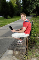 Image showing Young man with notebook