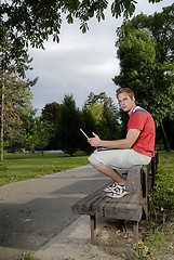 Image showing Young man with notebook