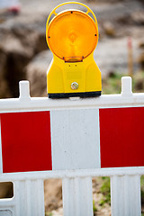 Image showing yellow signal lamp on construction site
