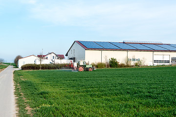 Image showing tractor applying fertilizer