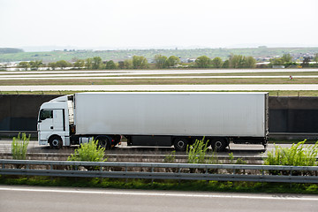 Image showing White truck moving on a highway