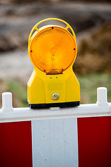 Image showing yellow signal lamp on construction site