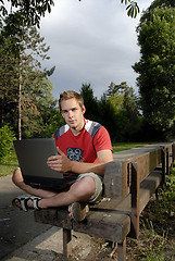 Image showing Young man with notebook