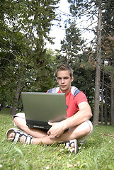 Image showing Young man with notebook