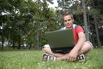 Image showing Young man with notebook