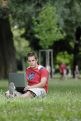 Image showing Young man with notebook