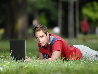 Image showing Young man with notebook