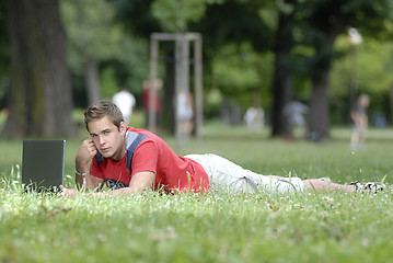 Image showing Young man with notebook