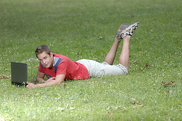 Image showing Young man with notebook