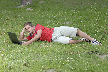 Image showing Young man with notebook