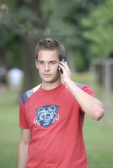 Image showing Young man talking on phone