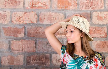 Image showing Portrait of a girl in a straw hat